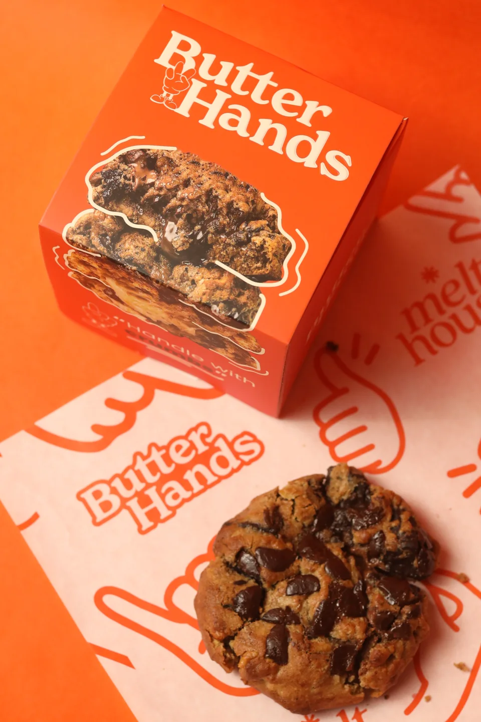 Butter Hands printed bakery packaging beside cookies