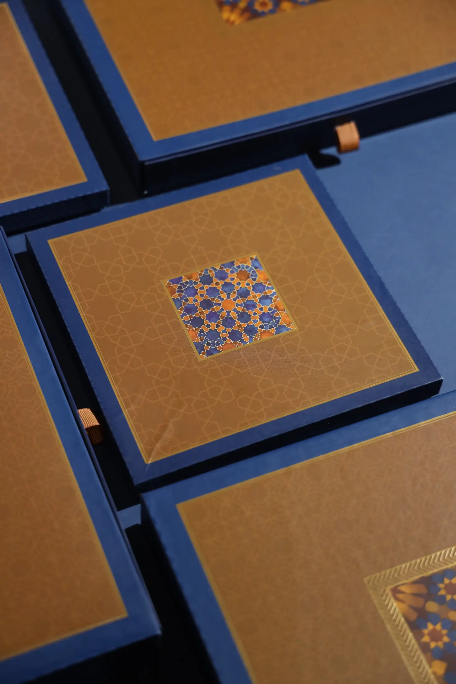 Blue and gold luxury rigid gift boxes with intricate printed detailing