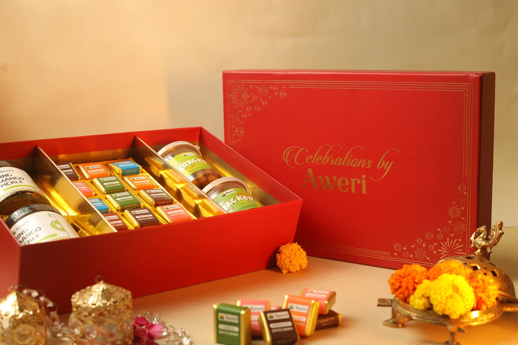Red festive rigid gift box with products and decorative styling