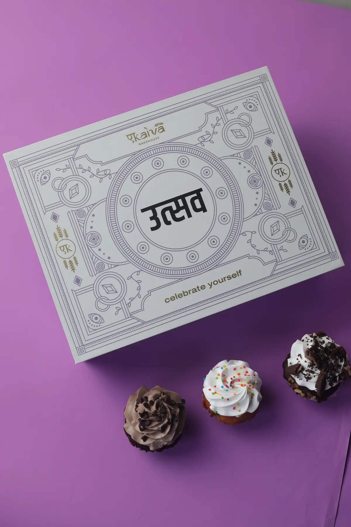 Illustrated white gift box photographed on a purple background