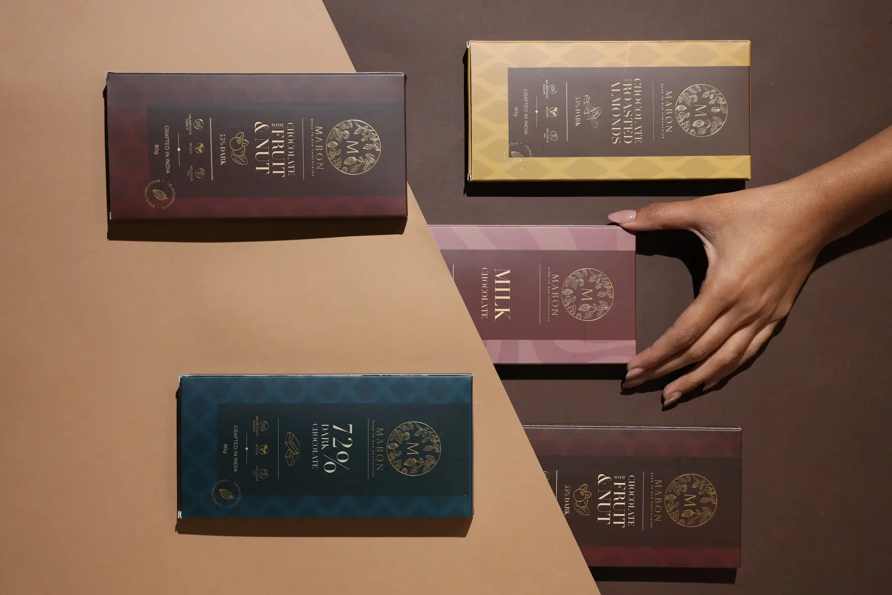 Collection of premium printed retail boxes arranged on a two-tone surface